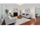 Bright living room with hardwood floors, fireplace, and comfortable seating area at 3 White Ash Dr, Durham, NC 27712