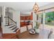 Cozy dining space with backyard view leads to the kitchen and second floor by an adjacent staircase at 3 White Ash Dr, Durham, NC 27712
