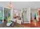 Bright dining area opens to a staircase and living room; hardwood floors flow into adjacent areas at 3 White Ash Dr, Durham, NC 27712