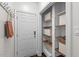Mud room featuring shelving, hooks, and exterior access at 3 White Ash Dr, Durham, NC 27712