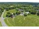 Bird's eye view captures a landscape with a silo and expansive green space in a rural setting at 31 W Madison, Pittsboro, NC 27312