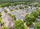 Overhead view capturing a residential neighborhood surrounded by lush greenery and tree-lined streets at 31 W Madison, Pittsboro, NC 27312