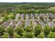 Overhead view of a residential neighborhood featuring tree-lined streets and manicured lawns at 31 W Madison, Pittsboro, NC 27312