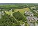 An aerial view featuring a blend of residential areas, open fields, and natural green spaces at 31 W Madison, Pittsboro, NC 27312