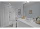 A well-lit bathroom features a shower-tub combination and a single sink, providing a functional and clean space at 31 W Madison, Pittsboro, NC 27312