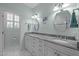 Dual sink bathroom offers lots of vanity storage and a separate toilet room at 31 W Madison, Pittsboro, NC 27312