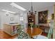 Eat-in kitchen with a round table, skylight, and an island with cookbook storage at 31 W Madison, Pittsboro, NC 27312