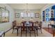Elegant dining room featuring a chandelier, wooden table, and classic decor at 31 W Madison, Pittsboro, NC 27312