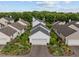 Charming home featuring a well-manicured lawn, lush landscaping, and an attached two-car garage at 31 W Madison, Pittsboro, NC 27312