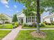 Charming home featuring a well-maintained lawn, lush landscaping and a brick walkway at 31 W Madison, Pittsboro, NC 27312