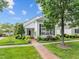 Charming home showcasing a beautifully landscaped front yard and a classic brick pathway at 31 W Madison, Pittsboro, NC 27312