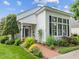 Inviting home exterior with manicured greenery and red brick walkway leading to a bright entrance at 31 W Madison, Pittsboro, NC 27312