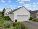Well-maintained garage with ample space, complemented by lush landscaping and a tidy driveway at 31 W Madison, Pittsboro, NC 27312