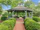 Comfortable gazebo interior featuring wooden benches and a relaxing view of the surrounding landscape at 31 W Madison, Pittsboro, NC 27312