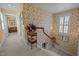 A charming hallway features floral wallpaper, carpeted floors, and decorative accents, creating a warm, inviting space at 31 W Madison, Pittsboro, NC 27312