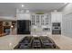 Modern kitchen featuring a granite countertop island and stainless steel appliances at 31 W Madison, Pittsboro, NC 27312