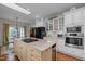 Spacious kitchen features an island cooktop, stainless steel appliances, and ample cabinet space at 31 W Madison, Pittsboro, NC 27312