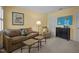 A cozy living room features carpet floors, sofa, and windows, creating a comfortable and inviting atmosphere at 31 W Madison, Pittsboro, NC 27312