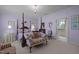Elegant primary bedroom featuring a chandelier and view to the ensuite bath at 31 W Madison, Pittsboro, NC 27312