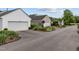 A street showcasing homes with well-maintained landscaping and attached garages, creating curb appeal at 31 W Madison, Pittsboro, NC 27312