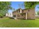 Expansive backyard view features a well-maintained lawn and exterior of home with deck and patio area at 325 Wescott Ridge Dr, Holly Springs, NC 27540