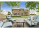 Relaxing backyard with patio featuring comfortable seating, perfect for outdoor entertaining and lounging at 325 Wescott Ridge Dr, Holly Springs, NC 27540