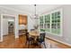 Dining area featuring large windows offering natural light and a view to the back yard at 325 Wescott Ridge Dr, Holly Springs, NC 27540