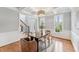 Elegant dining room featuring coffered ceilings, hardwood floors, and large windows that provide natural light at 325 Wescott Ridge Dr, Holly Springs, NC 27540
