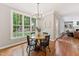 Dining room with hardwood floors, large windows, and a view to the back yard at 325 Wescott Ridge Dr, Holly Springs, NC 27540