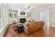 Inviting living room with a fireplace, built-in shelves, and comfortable seating arrangement at 325 Wescott Ridge Dr, Holly Springs, NC 27540