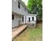 Charming backyard features a wooden deck with a ramp and easy access to the house at 3300 Barnsley Ln, Raleigh, NC 27604