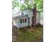 The backyard is private with mature trees, vinyl siding, and a screened in porch at 3300 Barnsley Ln, Raleigh, NC 27604