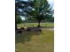 View of a baseball field with lush green grass and trees at 3300 Barnsley Ln, Raleigh, NC 27604