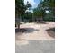 Concrete walkway leads to a baseball field with shaded trees and benches at 3300 Barnsley Ln, Raleigh, NC 27604