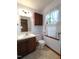 Cozy bathroom with vanity, toilet, and window with curtains at 3300 Barnsley Ln, Raleigh, NC 27604