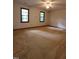 Bright bedroom with two windows and a ceiling fan, offering ample space and natural light at 3300 Barnsley Ln, Raleigh, NC 27604