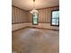 Classic dining room with natural light, neutral carpet, and wallpapered walls at 3300 Barnsley Ln, Raleigh, NC 27604