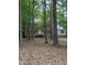 Charming brick home with a welcoming front entrance and lush greenery, perfect for serene living at 3300 Barnsley Ln, Raleigh, NC 27604