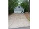 Detached two-car garage with a classic design, featuring a neat driveway and well-maintained exterior at 3300 Barnsley Ln, Raleigh, NC 27604