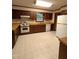 Charming kitchen with white appliances, wooden cabinets, and functional layout for cooking and gathering at 3300 Barnsley Ln, Raleigh, NC 27604