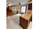 Open kitchen boasts breakfast bar and seamlessly connects to the living room at 3300 Barnsley Ln, Raleigh, NC 27604