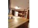 Traditional kitchen with wood cabinets, an island, and classic appliances for a functional cooking space at 3300 Barnsley Ln, Raleigh, NC 27604
