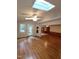 Bright living room with hardwood floors, skylights and access to the backyard at 3300 Barnsley Ln, Raleigh, NC 27604