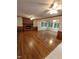Spacious living room features hardwood floors, a brick fireplace, and plenty of natural light at 3300 Barnsley Ln, Raleigh, NC 27604