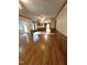 Open living room layout with hardwood floors seamlessly connects to the kitchen at 3300 Barnsley Ln, Raleigh, NC 27604