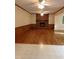 Open living room with wood floors, a cozy fireplace and neutral walls at 3300 Barnsley Ln, Raleigh, NC 27604