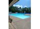 Outdoor swimming pool with marked lanes and lifeguard chair at 3300 Barnsley Ln, Raleigh, NC 27604