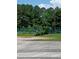 Fenced tennis court with benches available for play and relaxation at 3300 Barnsley Ln, Raleigh, NC 27604