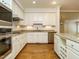 Eat-in kitchen features granite countertops, stainless appliances and wine rack at 3339 Ridgecrest Ct, Raleigh, NC 27607