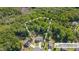 Aerial view of a home surrounded by lush trees, showcasing the expansive property lines at 40 Otter Ct, Youngsville, NC 27596